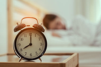 Close-up portrait of a man sleeping on bed at home