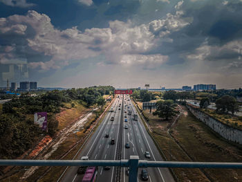 High angle view of highway in city against sky