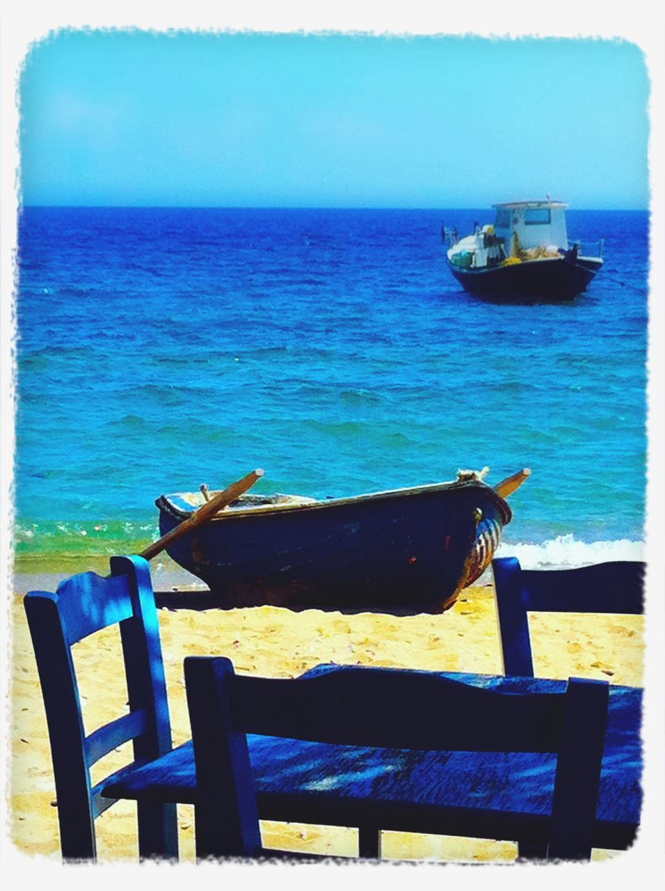 sea, horizon over water, water, transfer print, blue, tranquil scene, tranquility, scenics, beauty in nature, auto post production filter, nature, beach, sky, deck chair, chair, clear sky, absence, day, idyllic, ocean