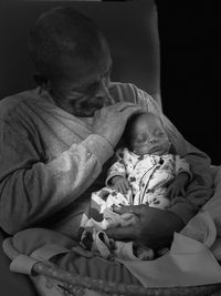 Man with granddaughter on bed