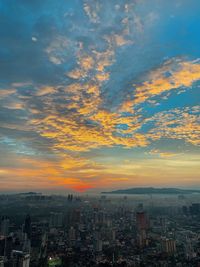 High angle view of buildings against sky during sunset