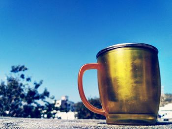 Close-up of drink against blue sky