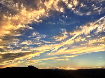 Scenic view of dramatic sky during sunset