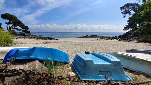 Scenic view of beach against blue sky