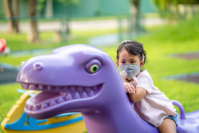 Portrait of cute boy in amusement park