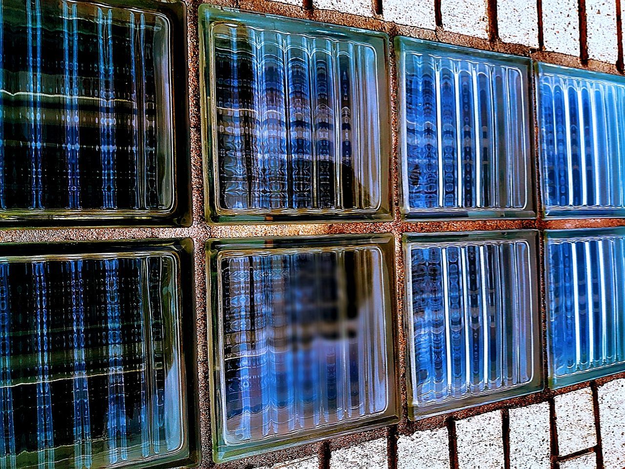 window, glass - material, pattern, no people, full frame, backgrounds, day, indoors, reflection, built structure, blue, glass, transparent, close-up, geometric shape, architecture, in a row, building