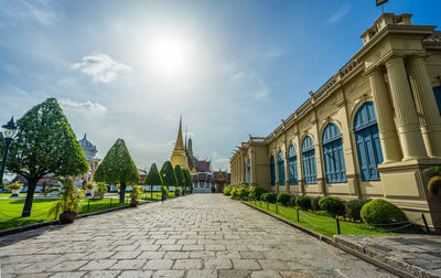 Street amidst buildings against sky