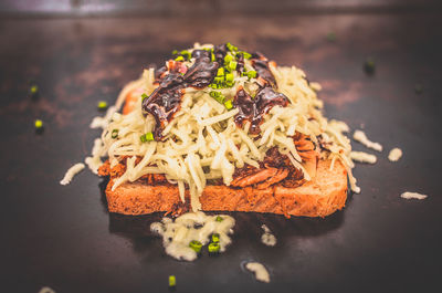 Close-up of open sandwich cooking on pan