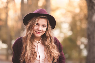 Portrait of smiling woman wearing hat