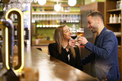 Young woman drinking wine in cafe