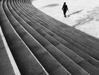 High angle view of man walking on footpath