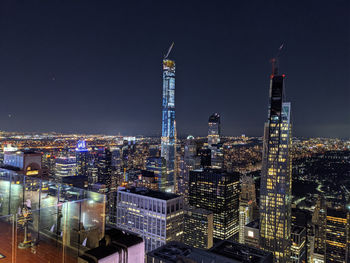 Illuminated buildings in city at night