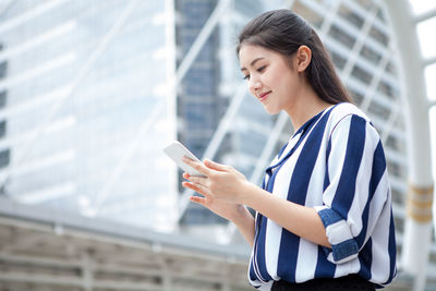 Young woman using mobile phone