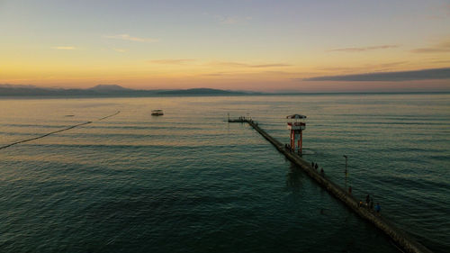 Scenic view of sea against sky during sunrise