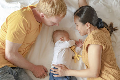 Mother and daughter on bed