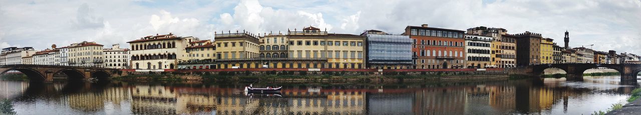 Panoramic view of bridge over canal against sky