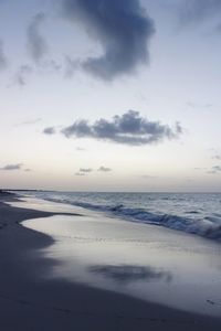 Scenic view of beach against sky during sunset