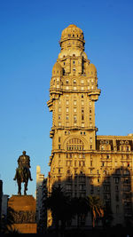 Low angle view of historical building against clear blue sky