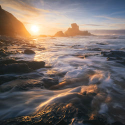 Scenic view of sea against sky during sunset
