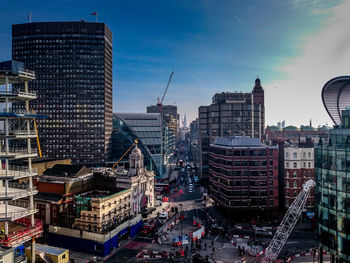 High angle view of cityscape against blue sky