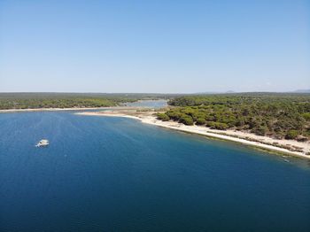 Scenic view of sea against clear blue sky