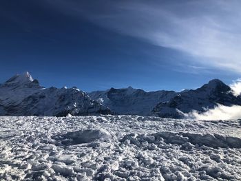 Scenic view of snowcapped mountains against sky