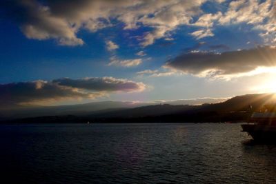 Scenic view of lake against dramatic sky