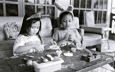 Happy girl sitting at market stall