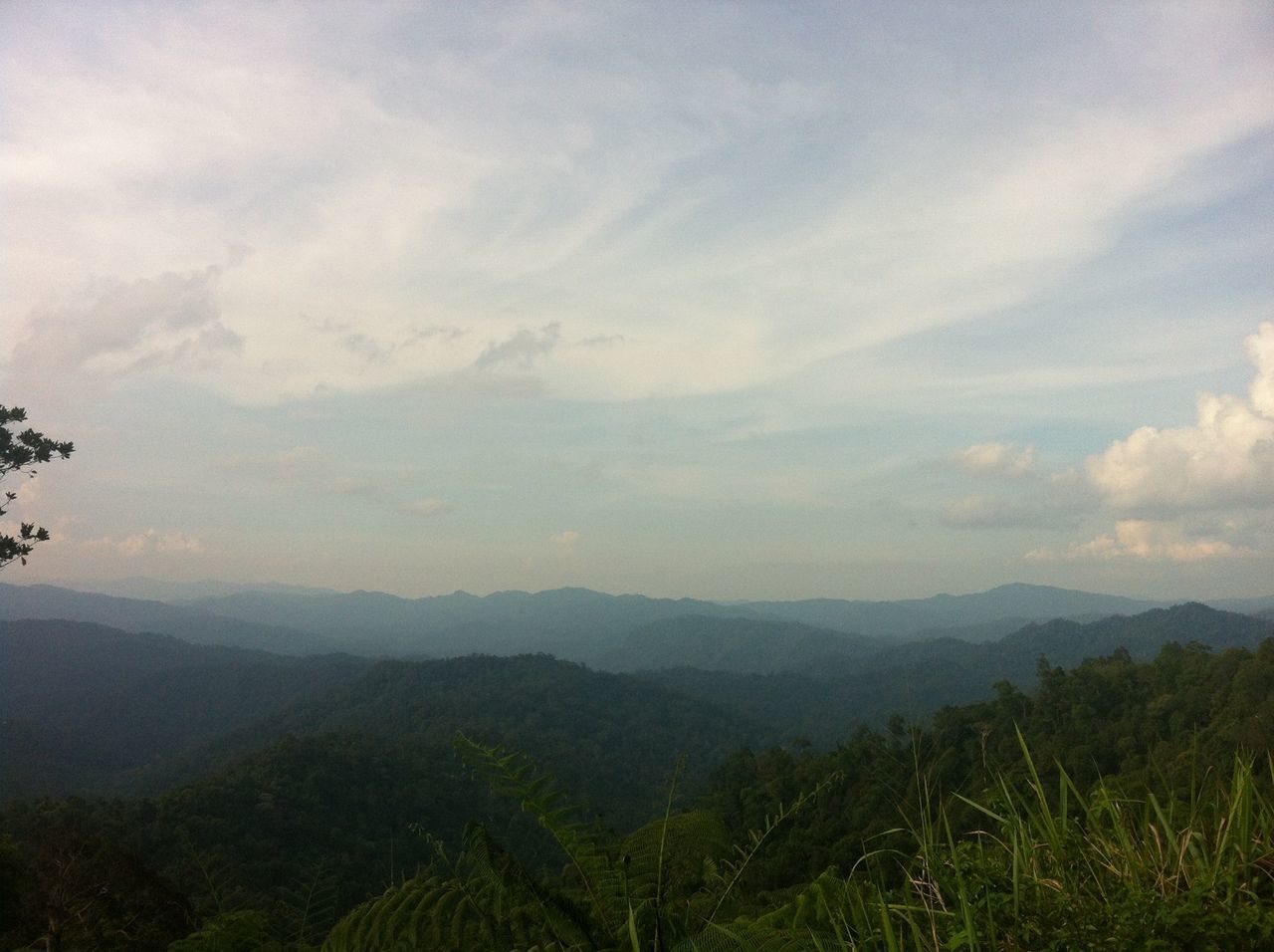 tranquil scene, tranquility, sky, mountain, scenics, landscape, beauty in nature, nature, mountain range, cloud - sky, non-urban scene, cloud, idyllic, plant, growth, remote, grass, cloudy, outdoors, horizon over land