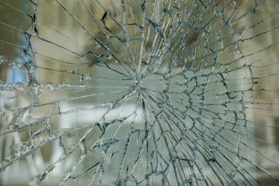 Close-up of cracked glass window