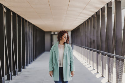 Woman standing on bridge