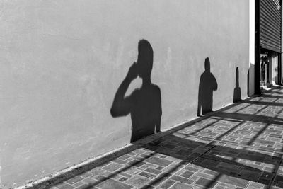 Shadow of woman on wall