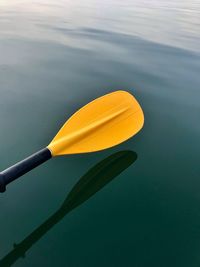 High angle view of yellow floating on sea