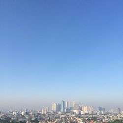 Cityscape against clear sky