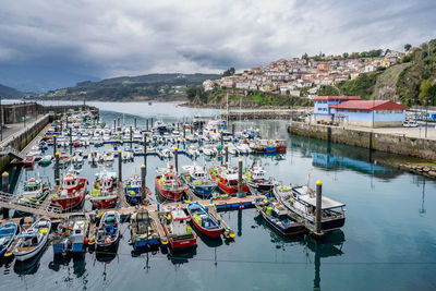 Boats moored at harbor