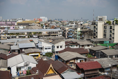 High angle view of buildings in city against sky