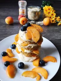 Close-up of cake with fruits in plate on table