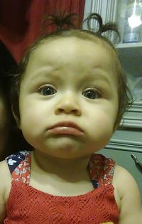 Close-up portrait of cute baby at home