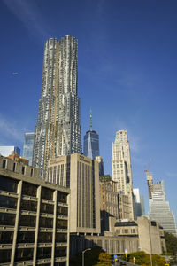 Low angle view of skyscrapers against clear sky