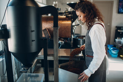 Barista preparing coffee at cafe