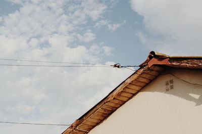 Low angle view of built structure against clouds