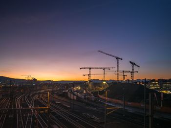 Railroad tracks against sky during sunset