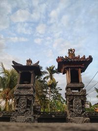 Low angle view of statue against sky