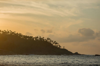 Scenic view of sea against sky at sunset
