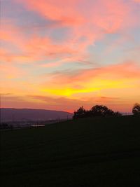 Scenic view of silhouette landscape against sky during sunset