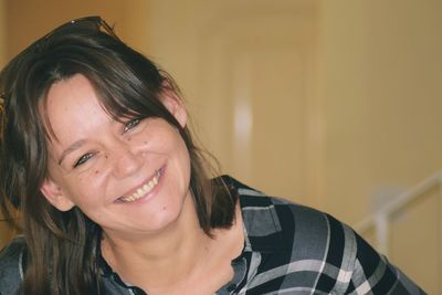 Portrait of smiling young woman at home