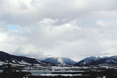 Scenic view of snowcapped mountains against sky