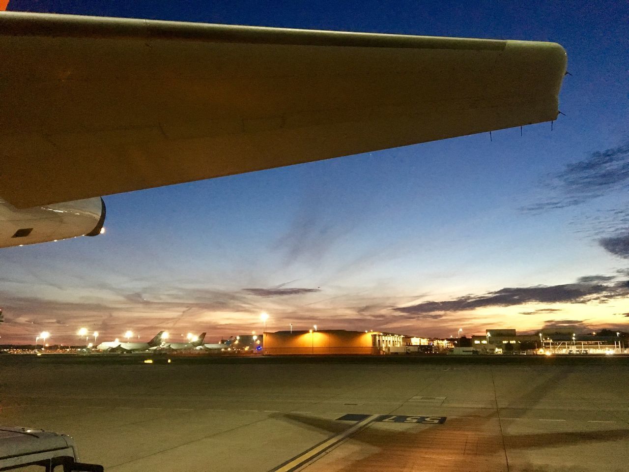 VIEW OF AIRPORT RUNWAY AGAINST SKY