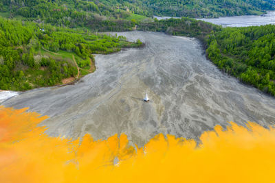 Aerial view of geamana church, romania flooded by copper mining waste water.