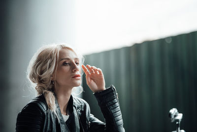 Portrait of young woman looking away